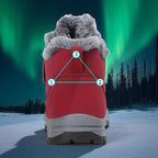 Warm Comfort Shoes vermelhos vistos de trás contra um céu com auroras boreais